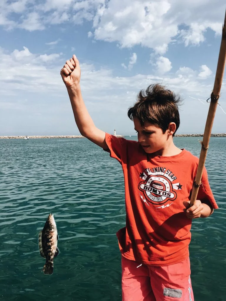 Selecting the right fishing spot can significantly enhance your child's fishing experience. 