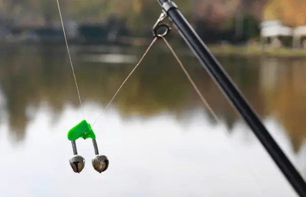 Clip-on bells, typically constructed from metal or plastic, are favoured for freshwater fishing and can be conveniently affixed to the rod tip or line. 